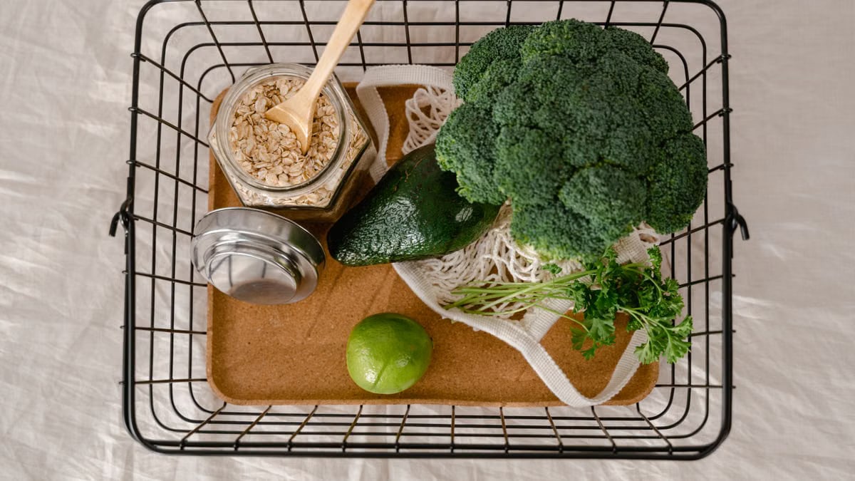 A basket of fresh produce and oats promoting a healthy and sustainable lifestyle.